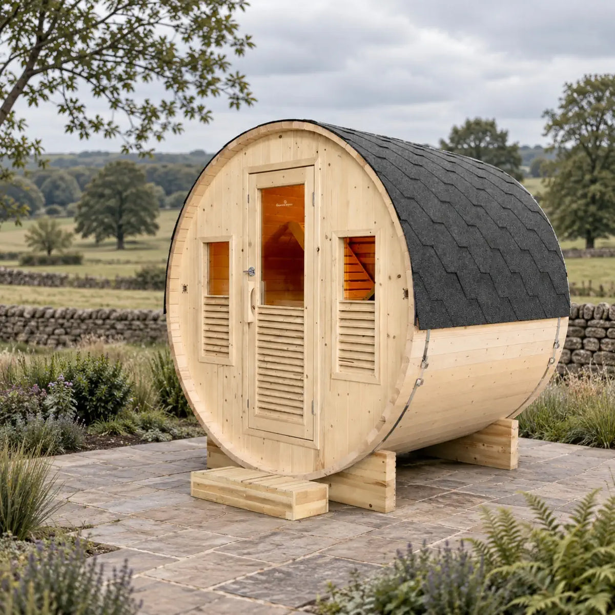 France Sauna Gaïa Bella outdoor sauna in a garden with louvre shutters