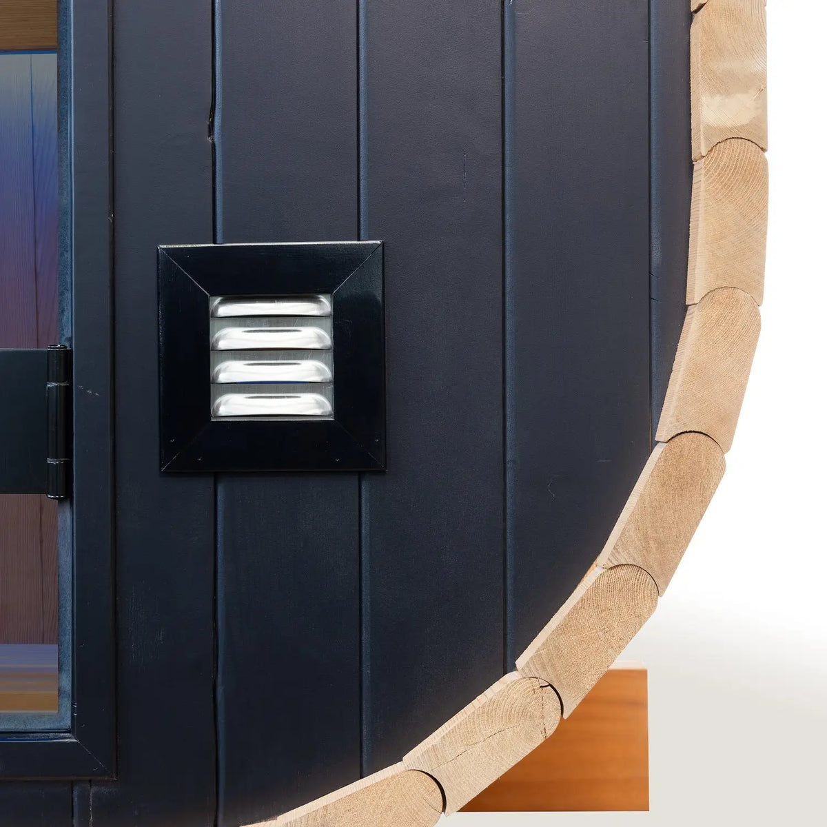 Holl's Cocoon 130 outdoor sauna exterior vent detail on the black cladding