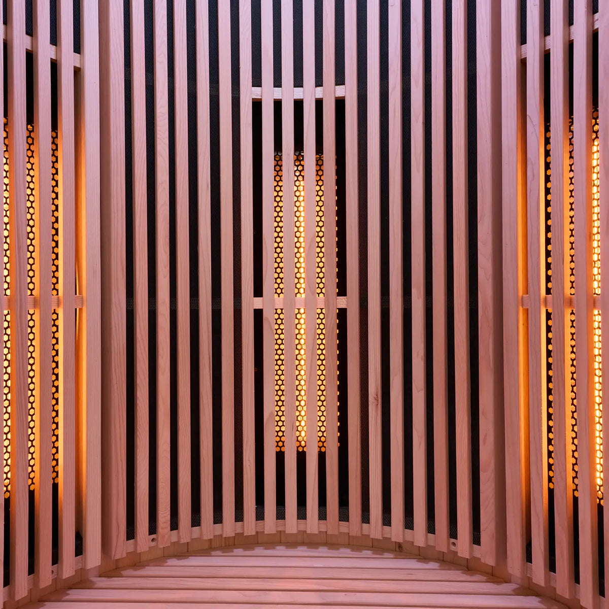 Holl's Moon 1 infrared sauna interior with slatted walls and emitters lit