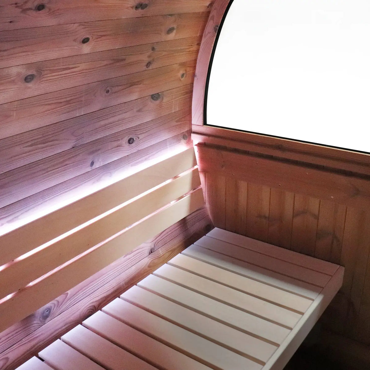 Holl's Onyxia Barrel outdoor sauna interior with bench and window