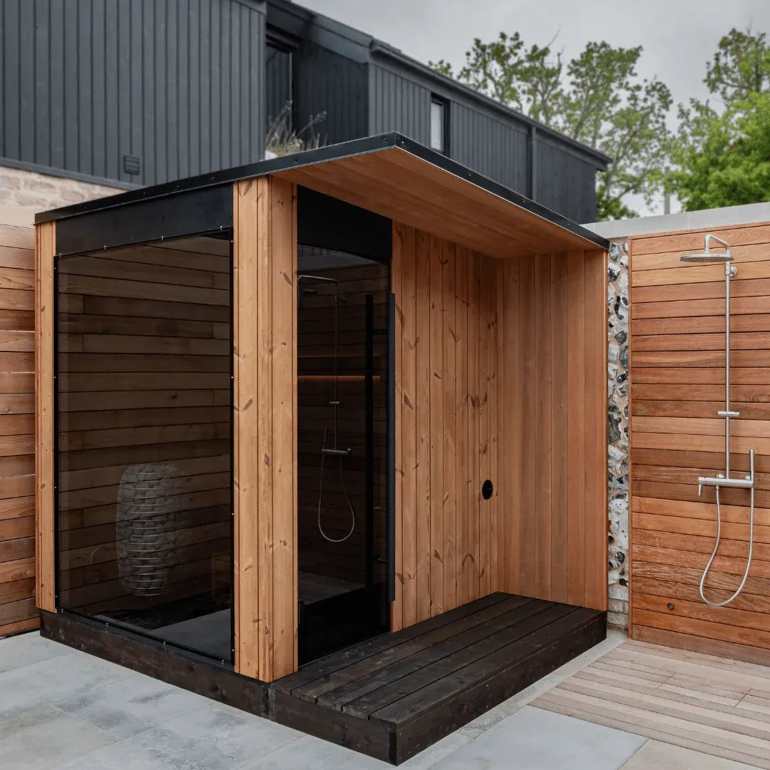 URSA outdoor sauna installed on a deck, full glass front and glass door