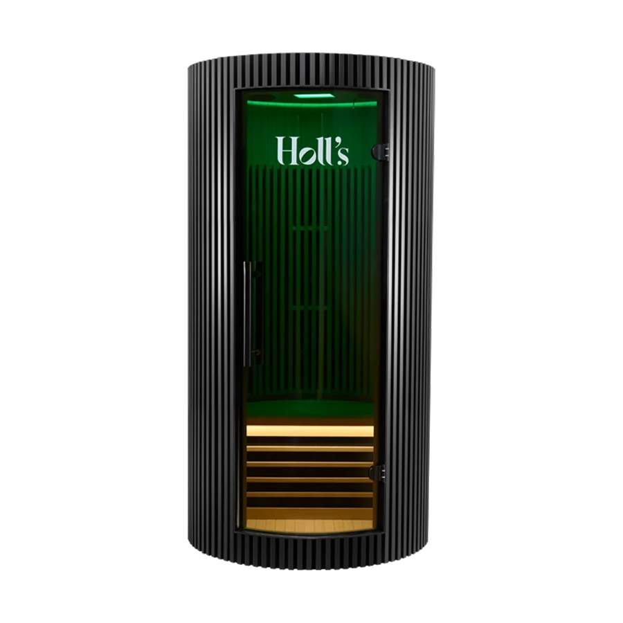 A black ribbed Holl's Moon 1 wooden sauna cabin with a curved exterior cylindrical far-infrared sauna cabinet with a glass door, illuminated green interior, and wood-look shelves