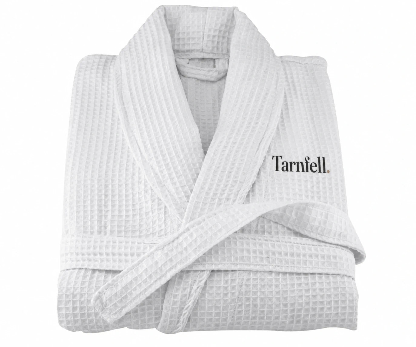 Tarnfell white cotton waffle gown folded, showing the shawl collar, tie belt and the Tarnfell wordmark embroidered on the left chest