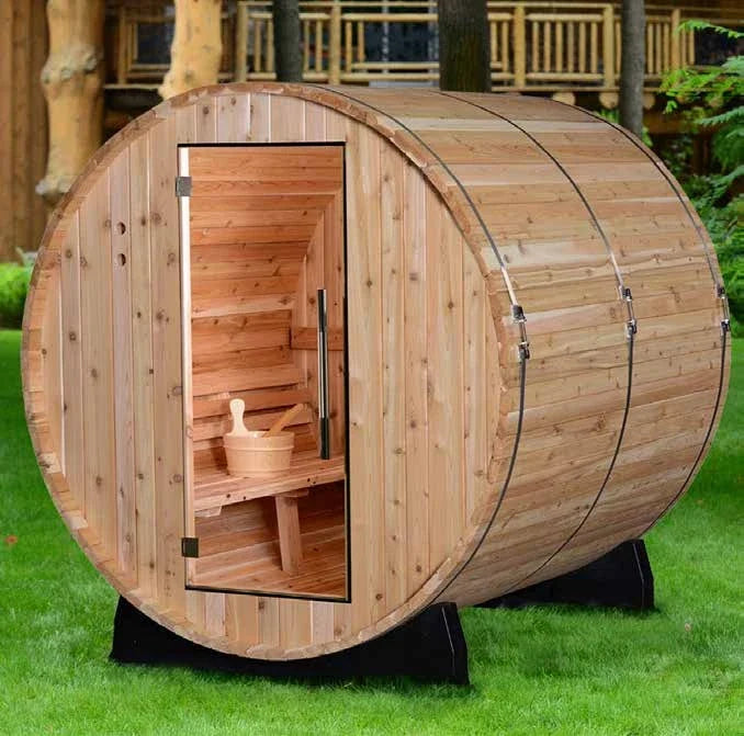 Almost Heaven Pinnacle barrel sauna in western red cedar, glass door and stainless bands, standing on grass