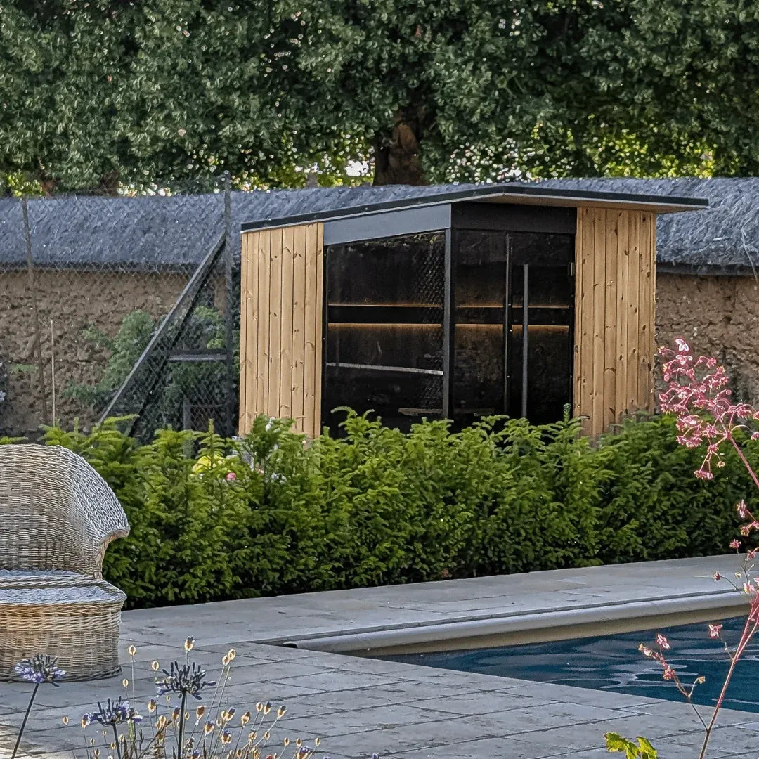 EDEN outdoor sauna in a garden beside a pool