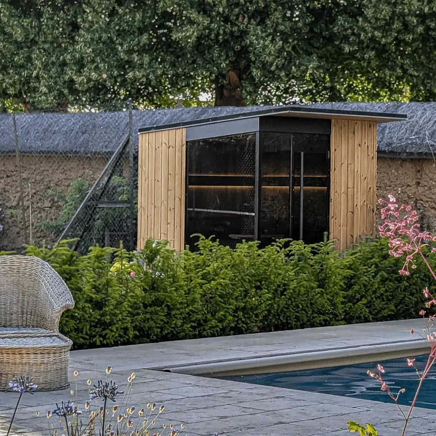 EDEN outdoor sauna in a garden beside a pool