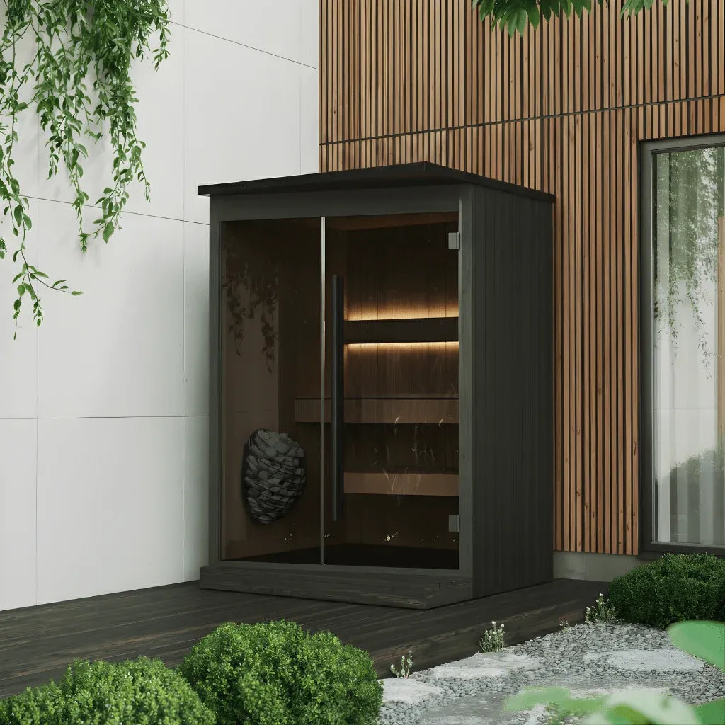 EMBA outdoor sauna in the black finish beside a house