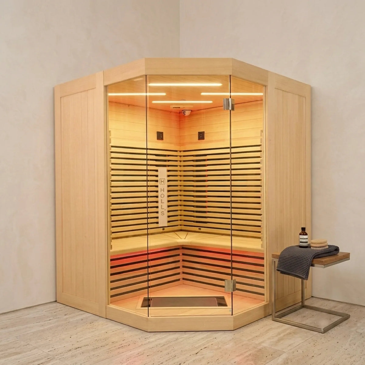 Holl's Canopée 3C corner infrared sauna, front view with angled glass door