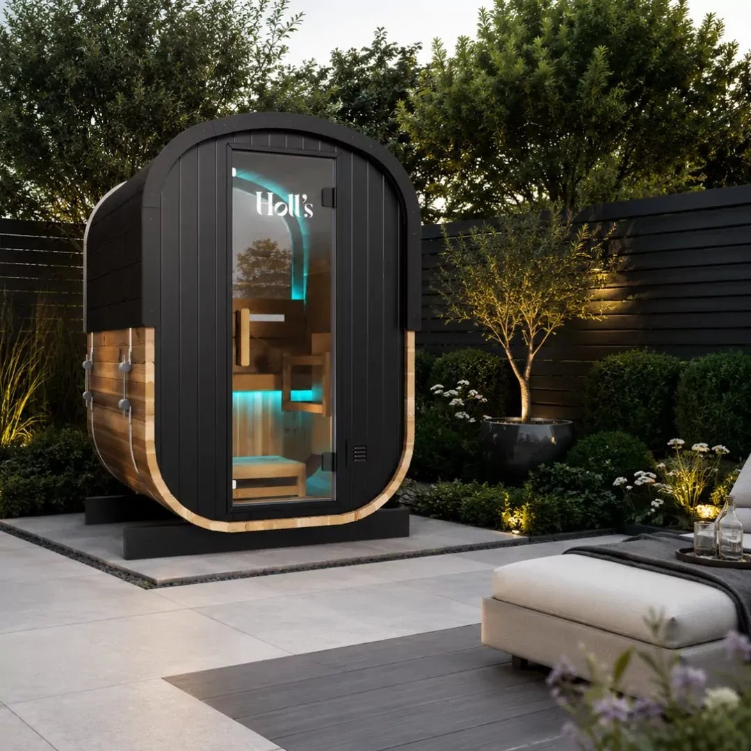 Holl's Cocoon 130 outdoor sauna on a patio with a fire pit and planting