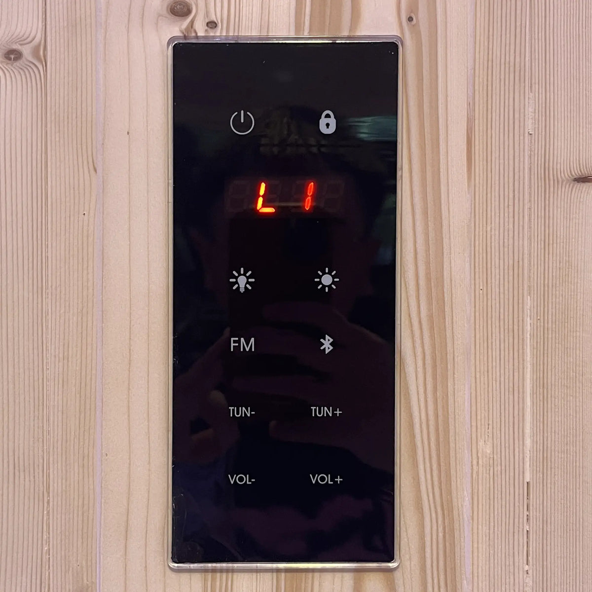 Holl's Utopia 4 touchscreen control panel on the cabin wall