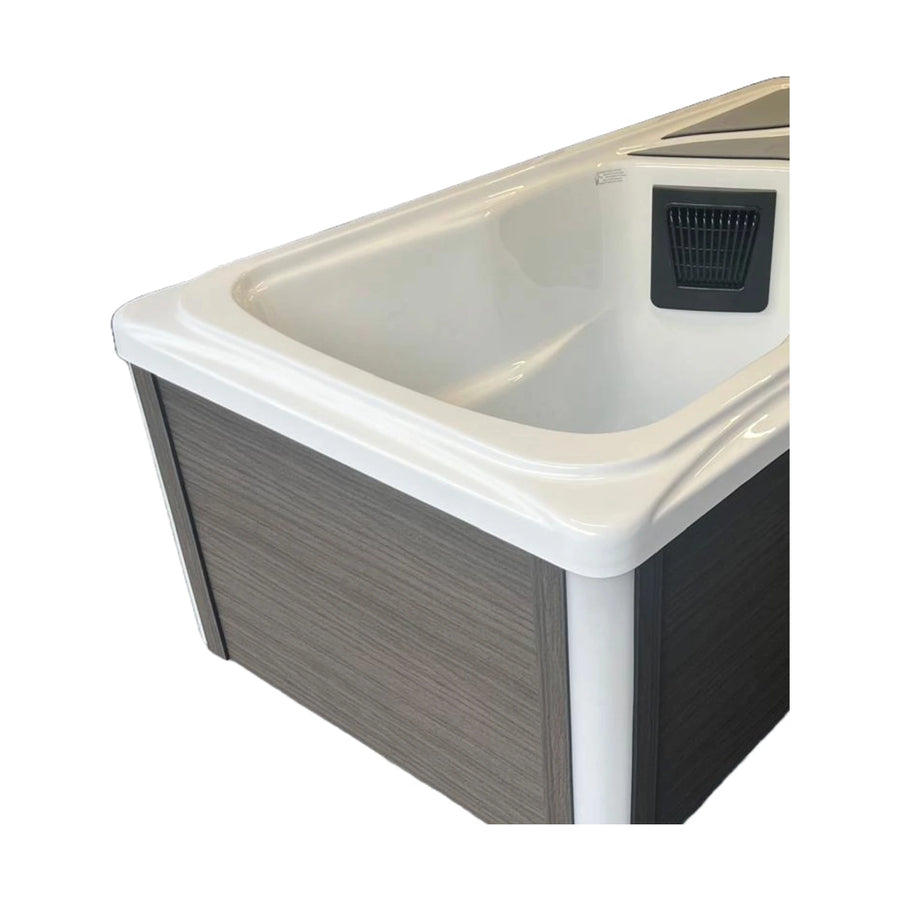 Remora ice plunge bath, close three quarter view showing the moulded tub and grey panels