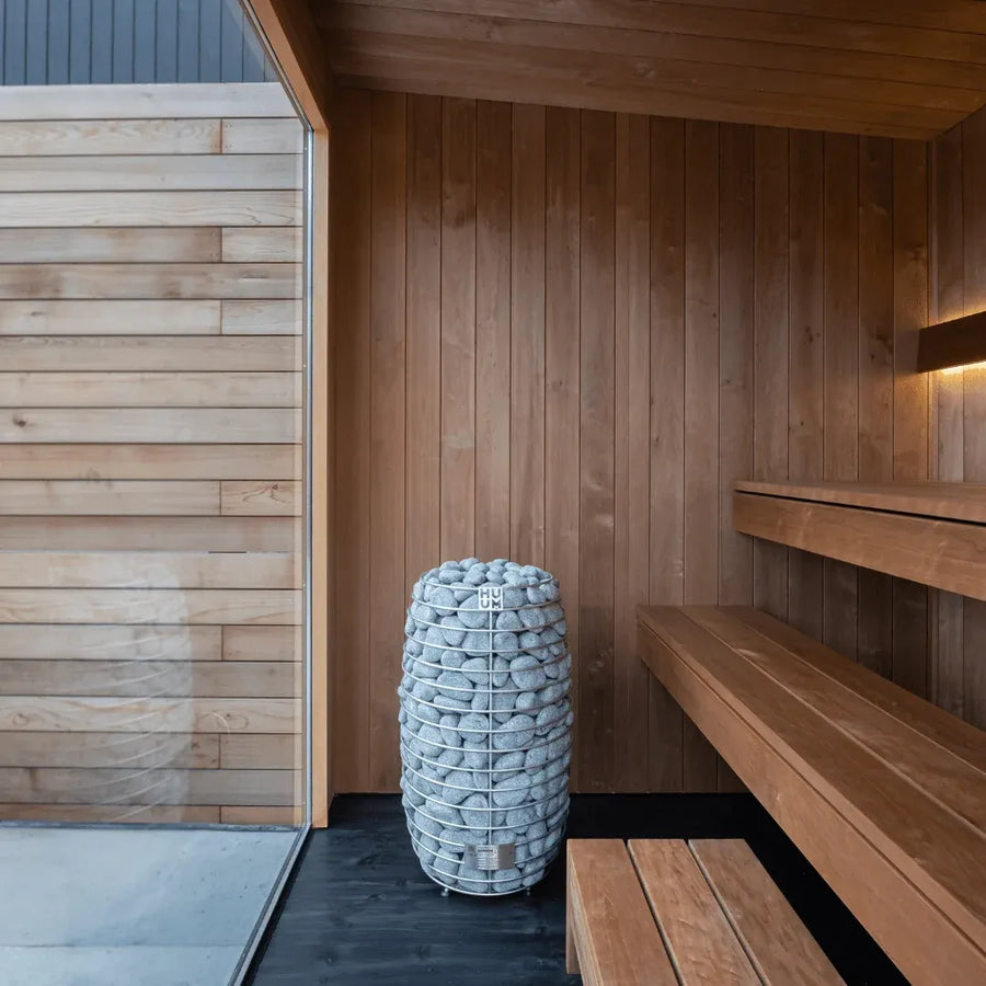 URSA interior detail: the heater and its stone column beside the benches