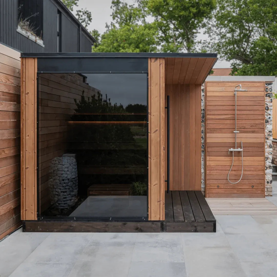URSA outdoor sauna exterior showing the roof overhang and glass front